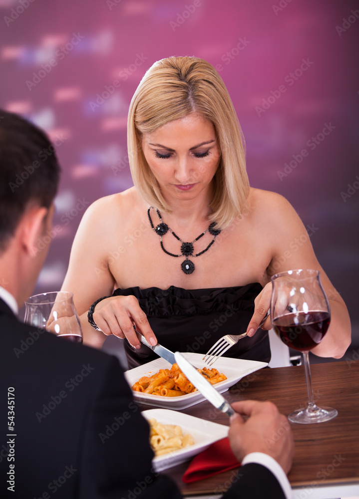 Couple Having Dinner At Restaurant Couple Having Dinner At Restaurant