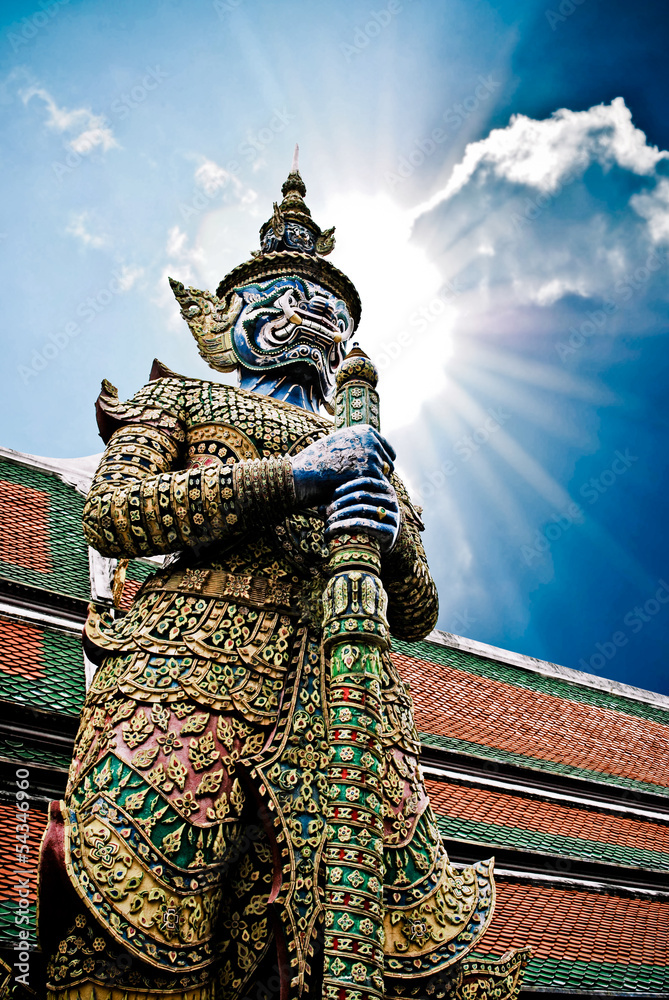 Fototapeta premium Ancient giant sculpture of The Emerald Buddha temple in Bangkok,