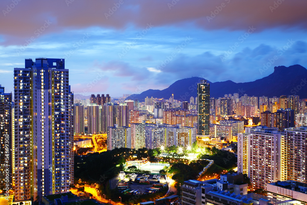 Kowloon side in Hong Kong at night with lion rock