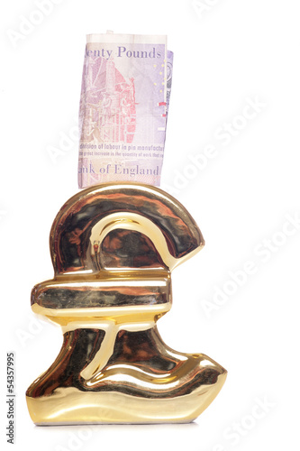 Pound symbol money box with twenty pounds photo