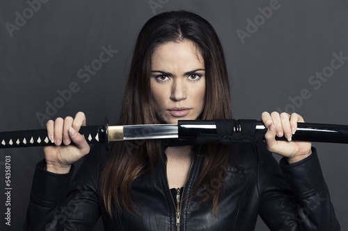 Portrait of beautiful woman with Katana