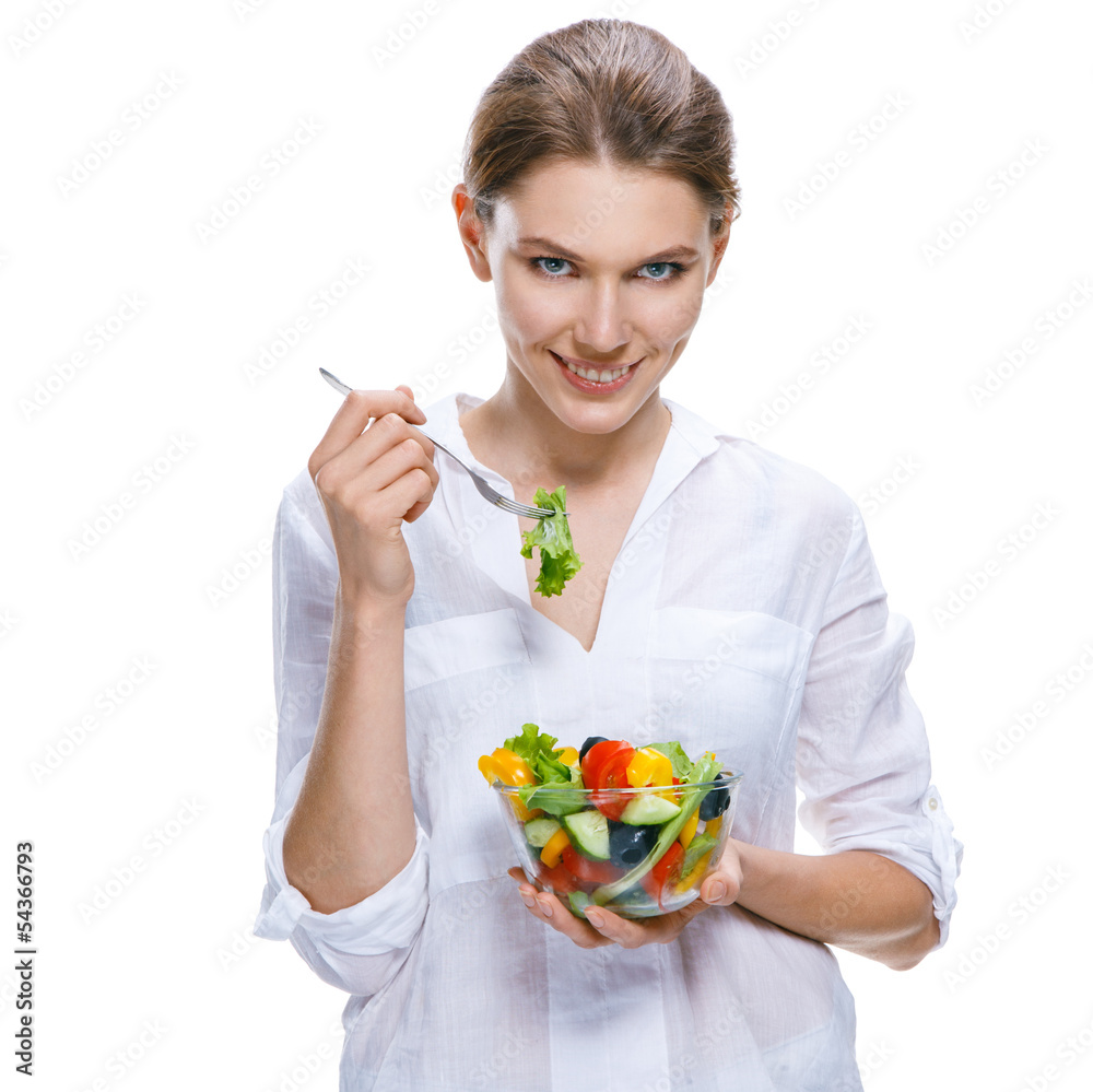 Young beautiful woman with vegetable salad bowl and fork in hand Young beautiful woman with vegetable salad bowl and fork in hand