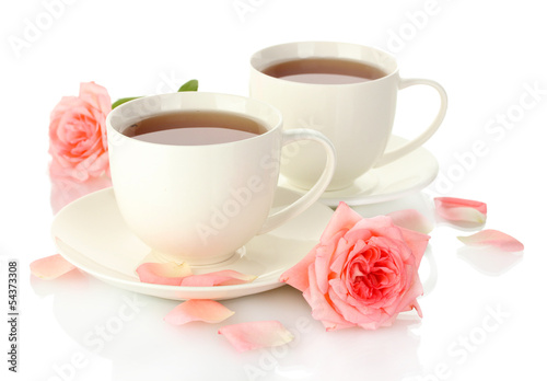 cups of tea with roses isolated on white