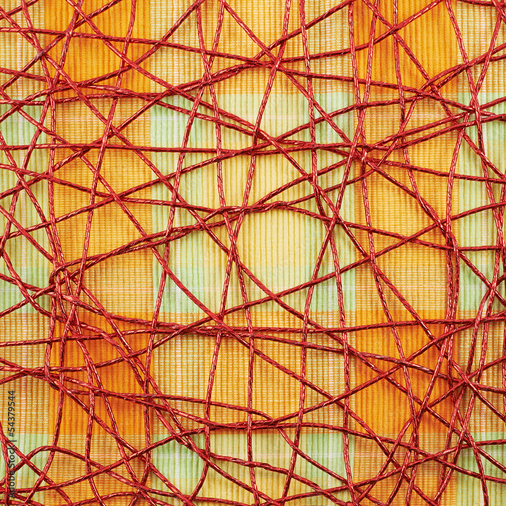 Cloth mat covered with red thread
