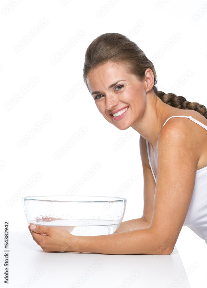 Portrait of happy young woman and glass bowl with water Portrait of happy young woman and glass bowl with water