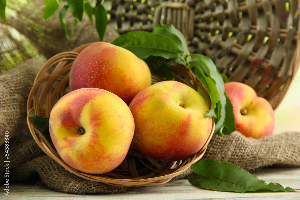 Ripe sweet peaches on wooden table, close up Ripe sweet peaches on wooden table, close up