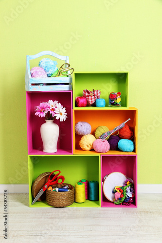 Colorful shelves of different colors with utensils