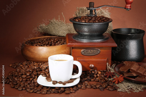 cup of coffee, grinder, turk and coffee beans