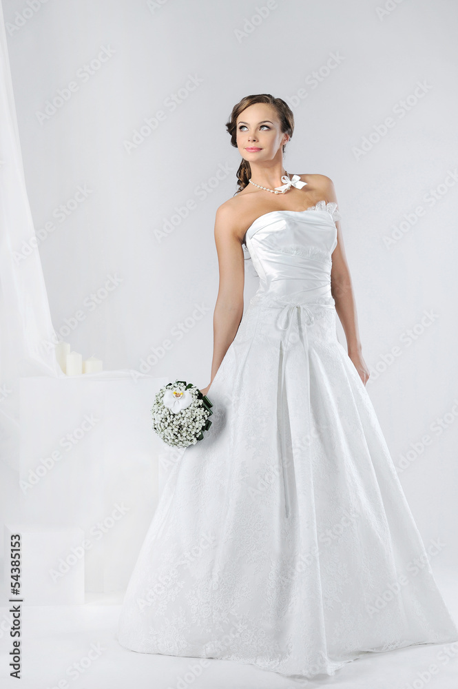 Beautiful bride in a luxurious wedding dress Beautiful bride in a luxurious wedding dress