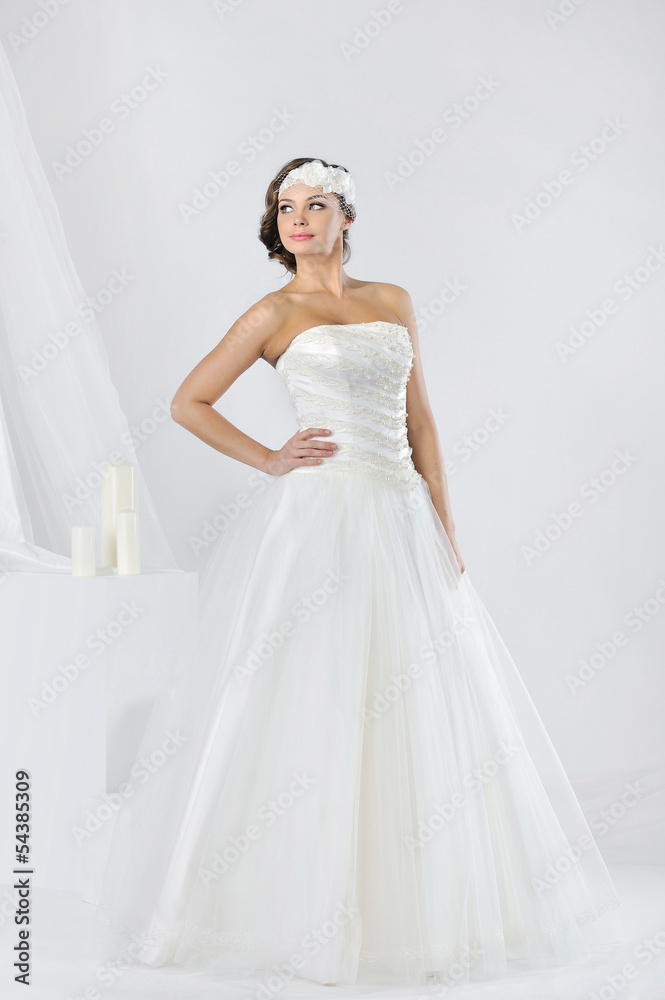 Beautiful bride in a luxurious wedding dress Beautiful bride in a luxurious wedding dress