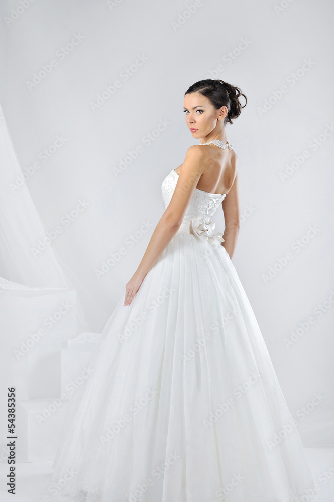 Beautiful bride in a luxurious wedding dress Beautiful bride in a luxurious wedding dress
