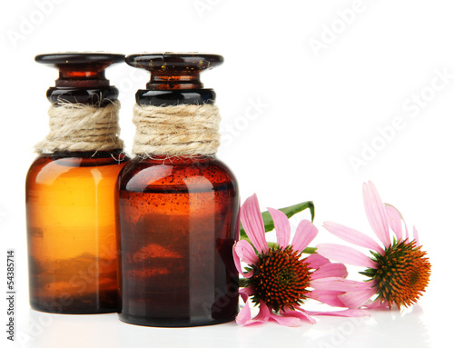 Medicine bottles with purple echinacea, isolated on white