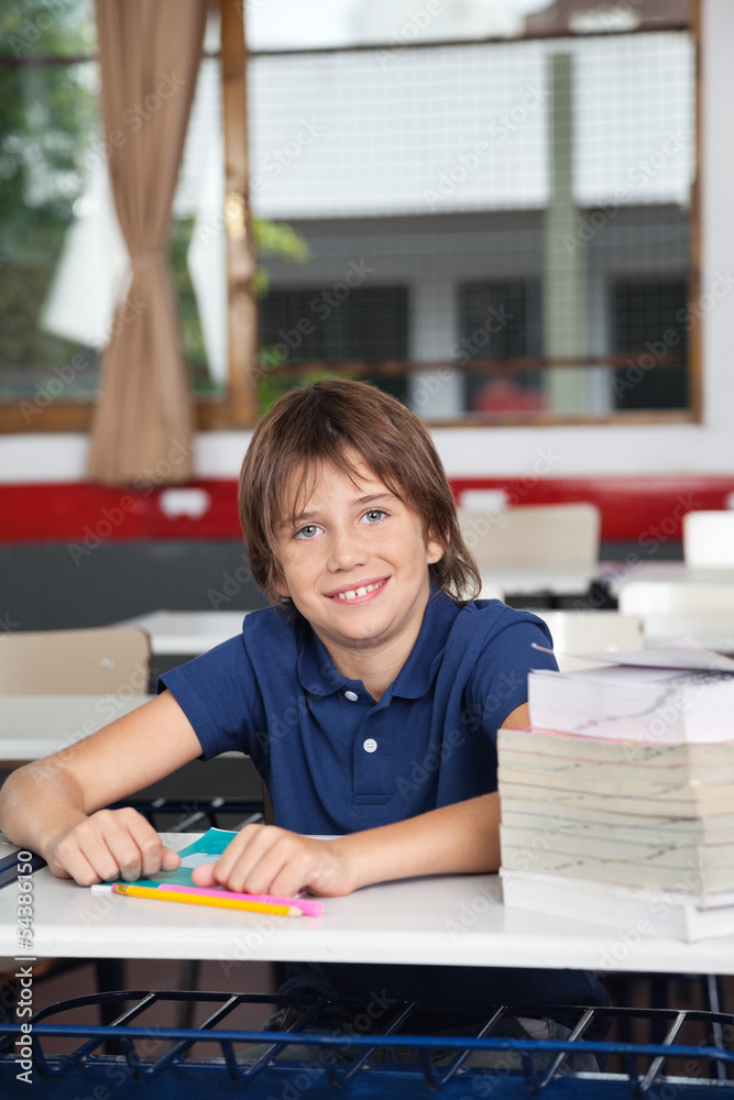 Schoolboy With Books And Globe At Desk Schoolboy With Books And Globe At Desk