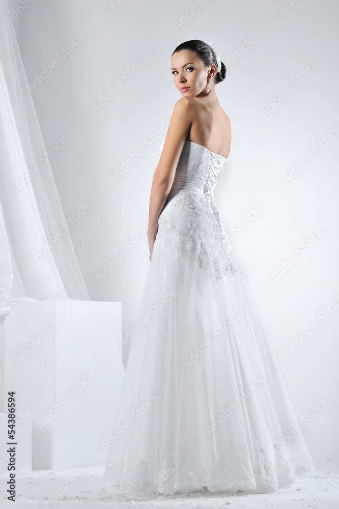 Beautiful bride in a luxurious wedding dress Beautiful bride in a luxurious wedding dress