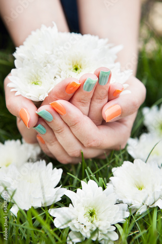 Close Up Of Woman s Hands Holding Flower