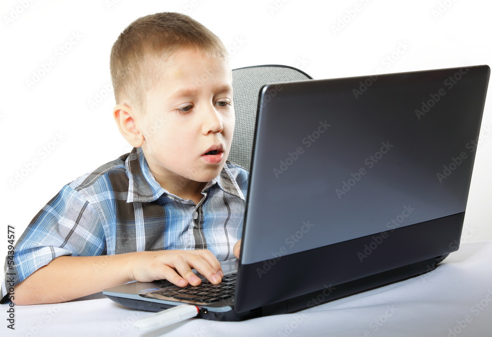 Computer addiction child with laptop notebook Computer addiction child with laptop notebook
