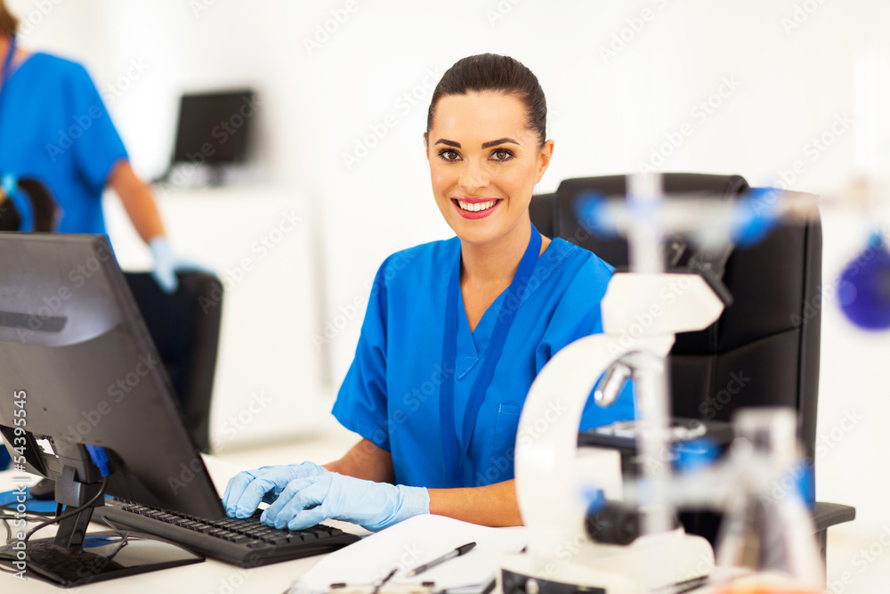 medical researcher working on computer in laboratory medical researcher working on computer in laboratory