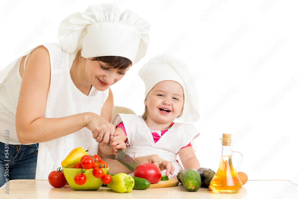 Chef mom and kid preparing healthy food Chef mom and kid preparing healthy food