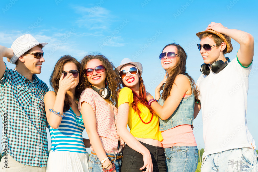 group of young people wearing sunglasses and hat group of young people wearing sunglasses and hat