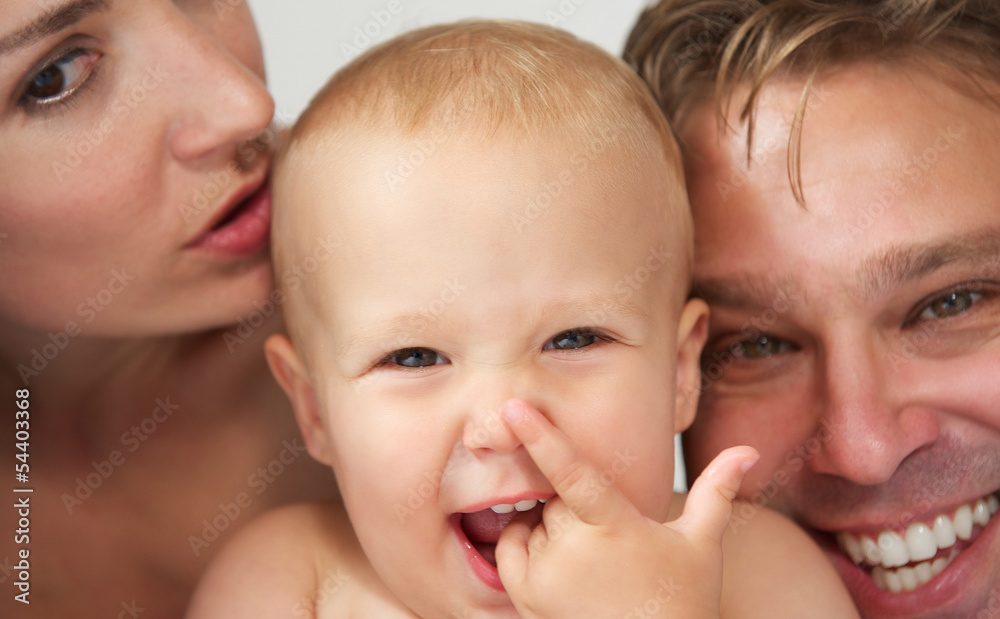 Portrait of a happy caucasian family with baby