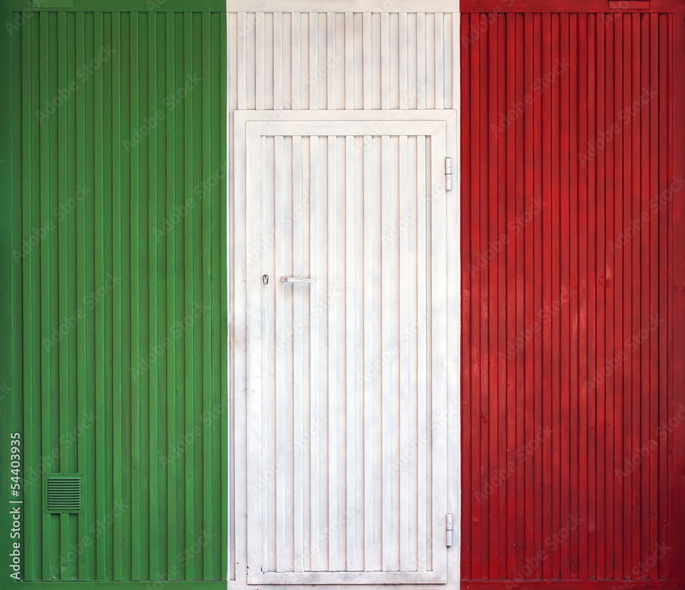 Italian flag on the background of old locked doors Italian flag on the background of old locked doors