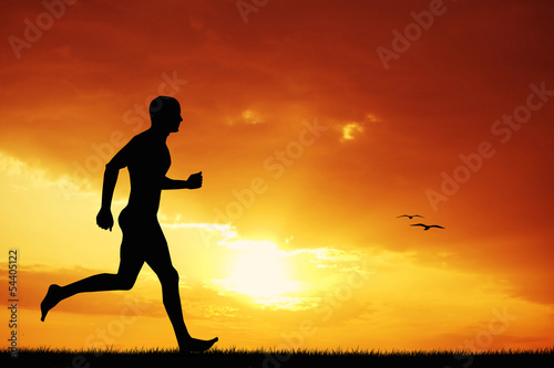Fototapeta Naklejka Na Ścianę i Meble -  Man running at sunset