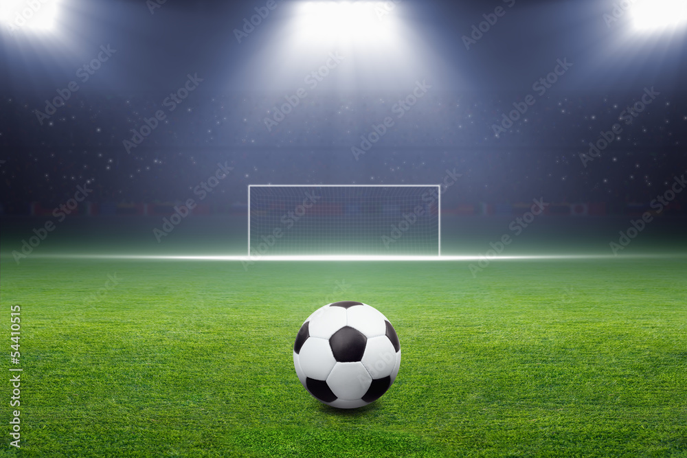 Soccer ball, goal, spotlight