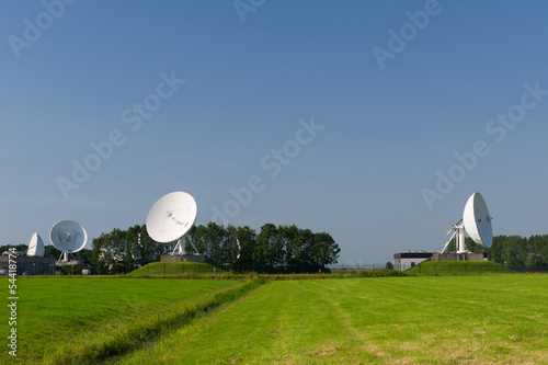 Satellite dishes in landscape