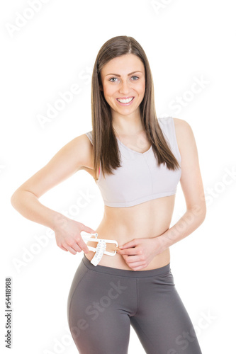 Young woman using body fat caliper