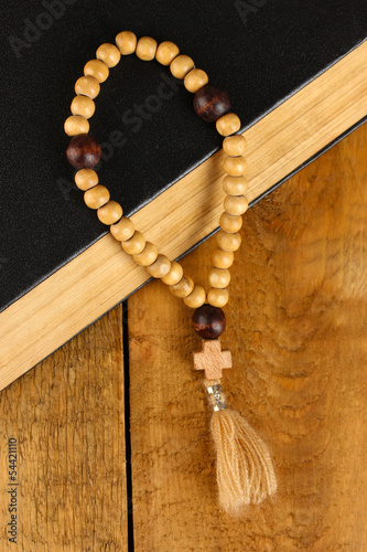 the Wooden rosary beads and holy bible