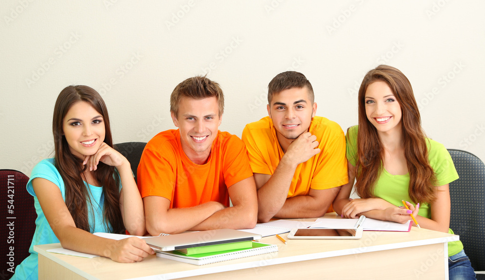 Group of young students sitting in the room Group of young students sitting in the room