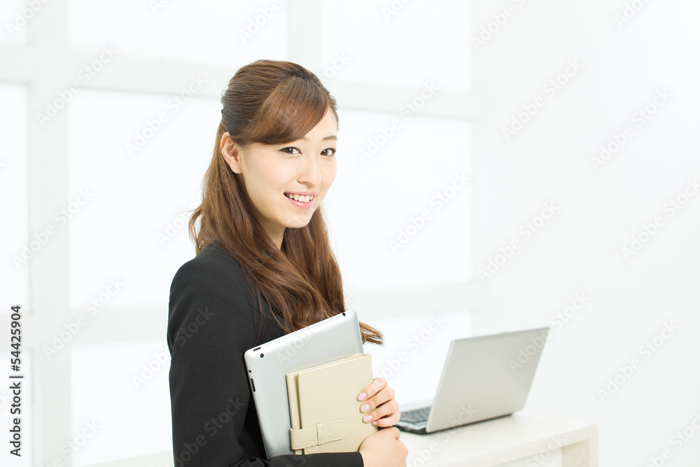 Beautiful young businesswoman working in office Beautiful young businesswoman working in office