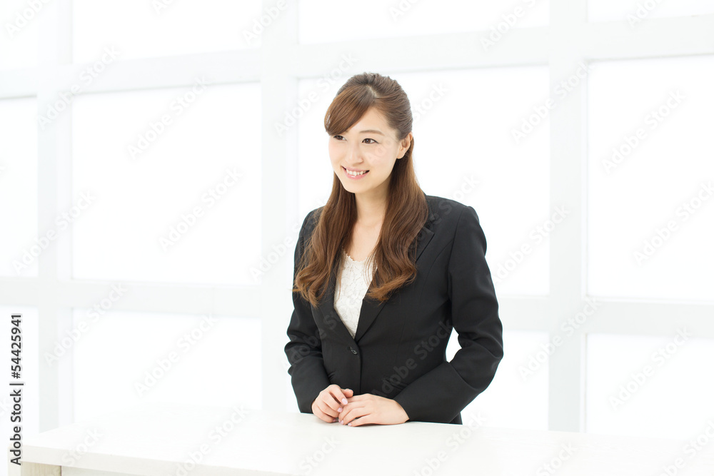 Beautiful young businesswoman working in office Beautiful young businesswoman working in office