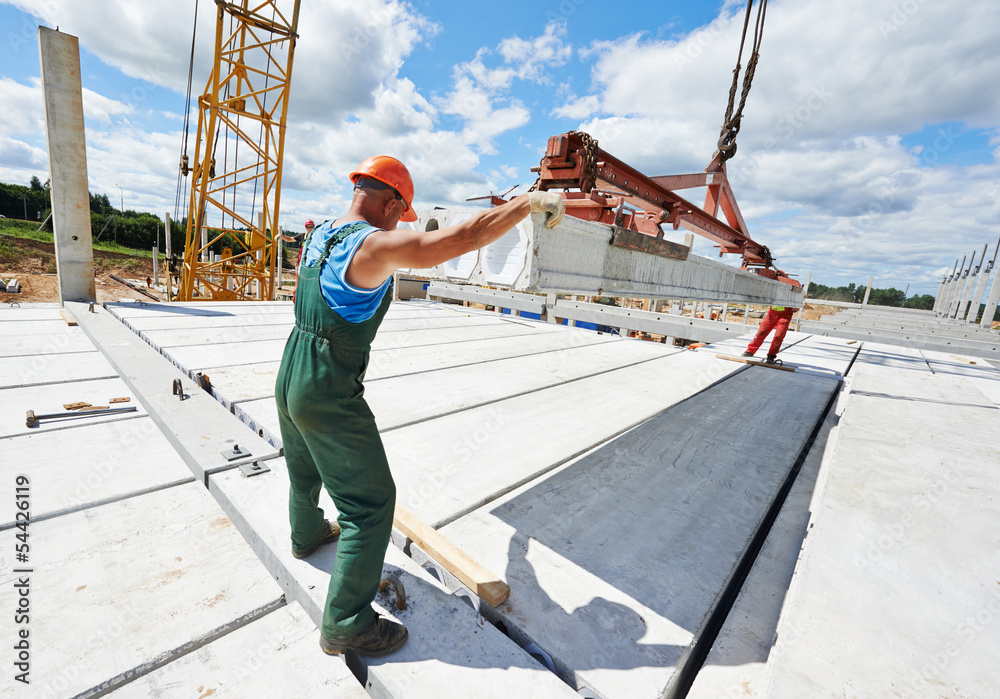 builder worker installing concrete slab