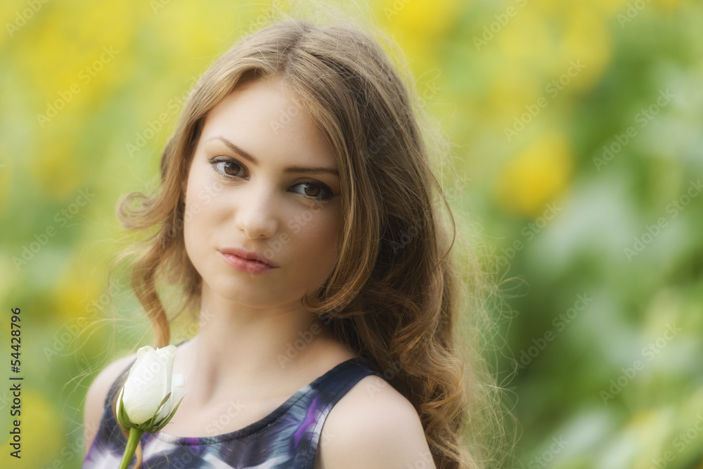 Romantic woman with rose lying on sunflowers field Romantic woman with rose lying on sunflowers field