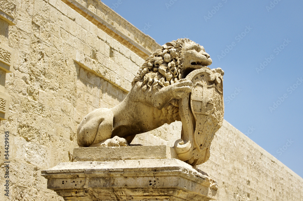 Lion with the coat of arms near Main Gate city Mdina in Malta