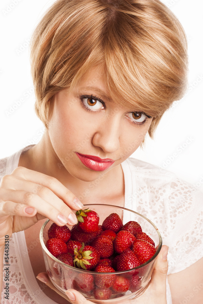 beautiful blond girl eating strawberries isolated on beautiful blond girl eating strawberries isolated on