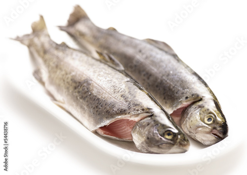 raw trouts on a plate ready to cook