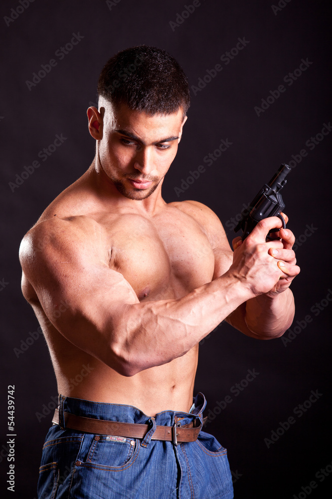 bodybuilder with gun bodybuilder with gun