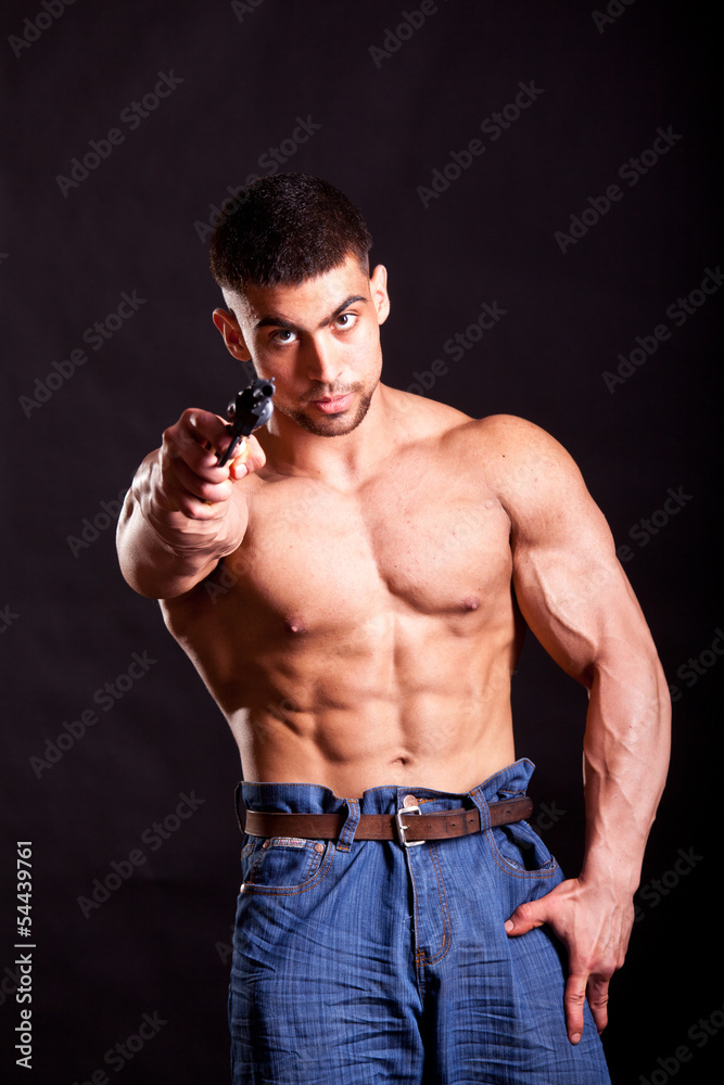 bodybuilder with gun bodybuilder with gun