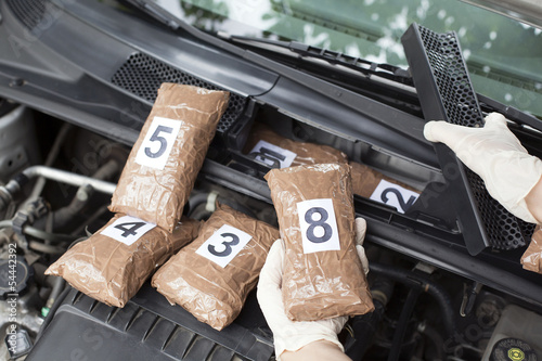 hidden drugs in a vehicle compartment