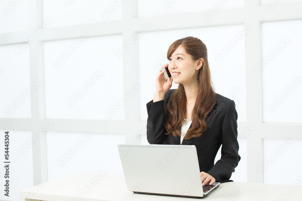 Beautiful young businesswoman working in office Beautiful young businesswoman working in office
