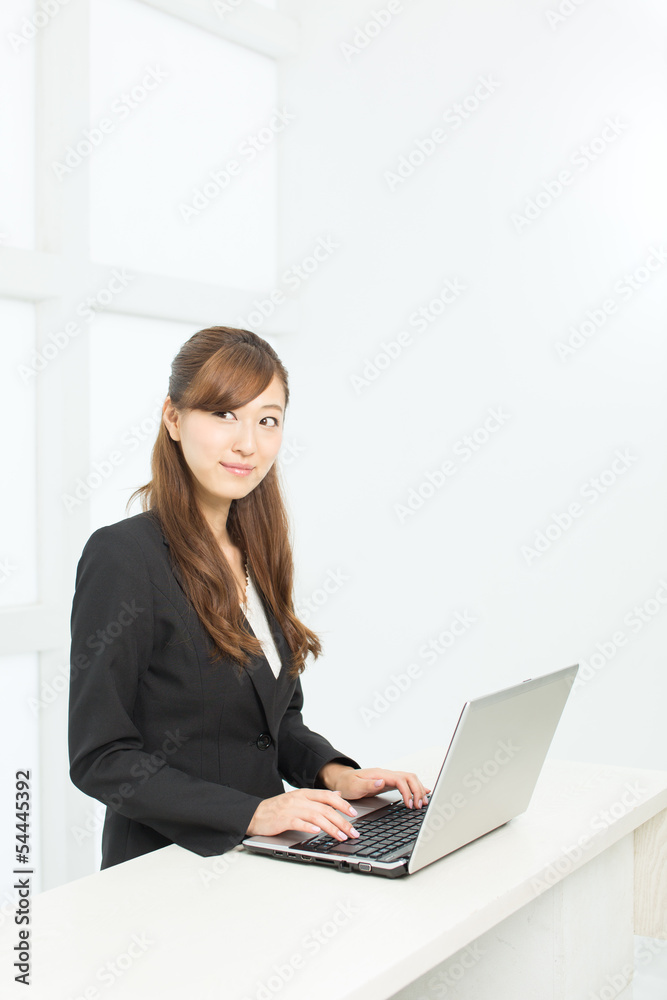 Beautiful young businesswoman working in office Beautiful young businesswoman working in office