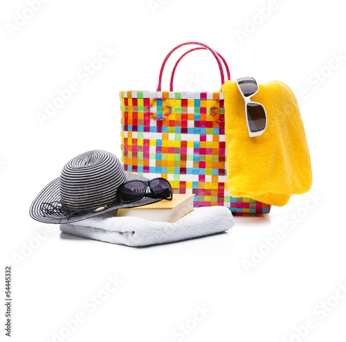 Badetasche und Lektüre