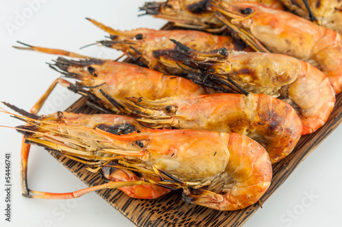 grilled prawns on wood white isolate