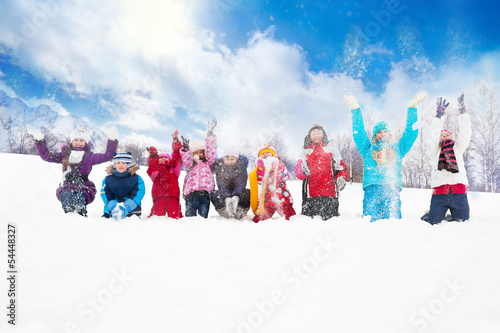 Group of kids throwing snow in the air