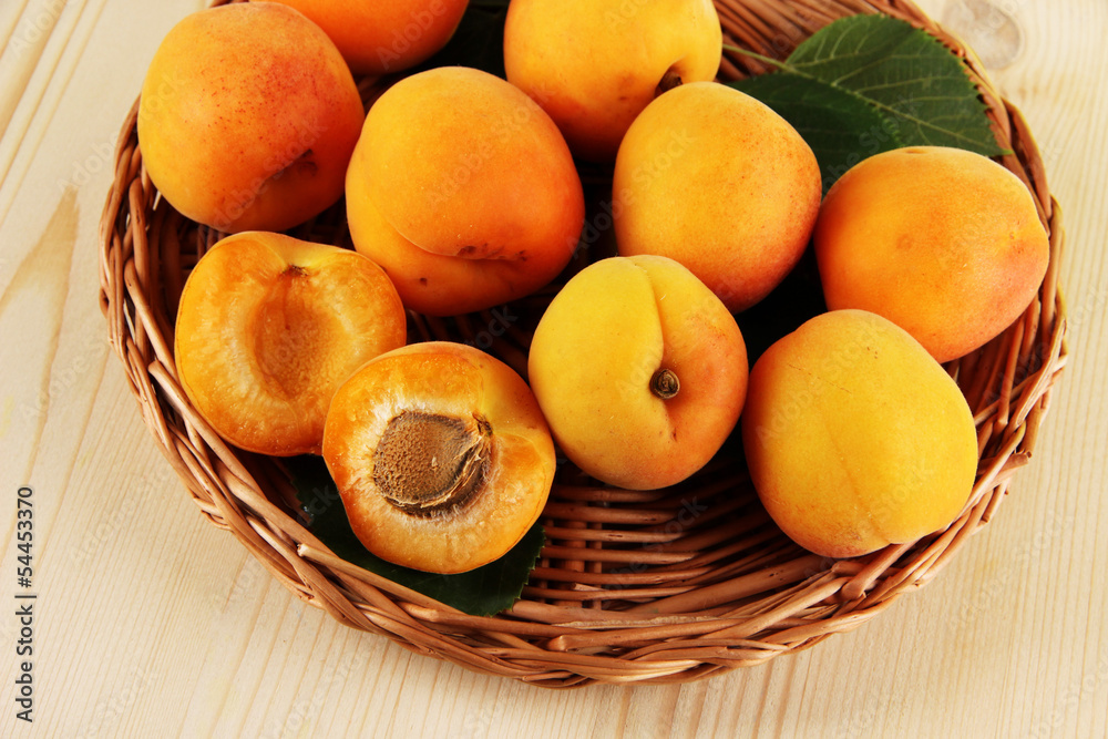 Apricots on wicker coasters on wooden table Apricots on wicker coasters on wooden table