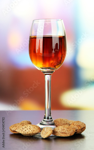 Glass of amaretto liquor and roasted almonds,