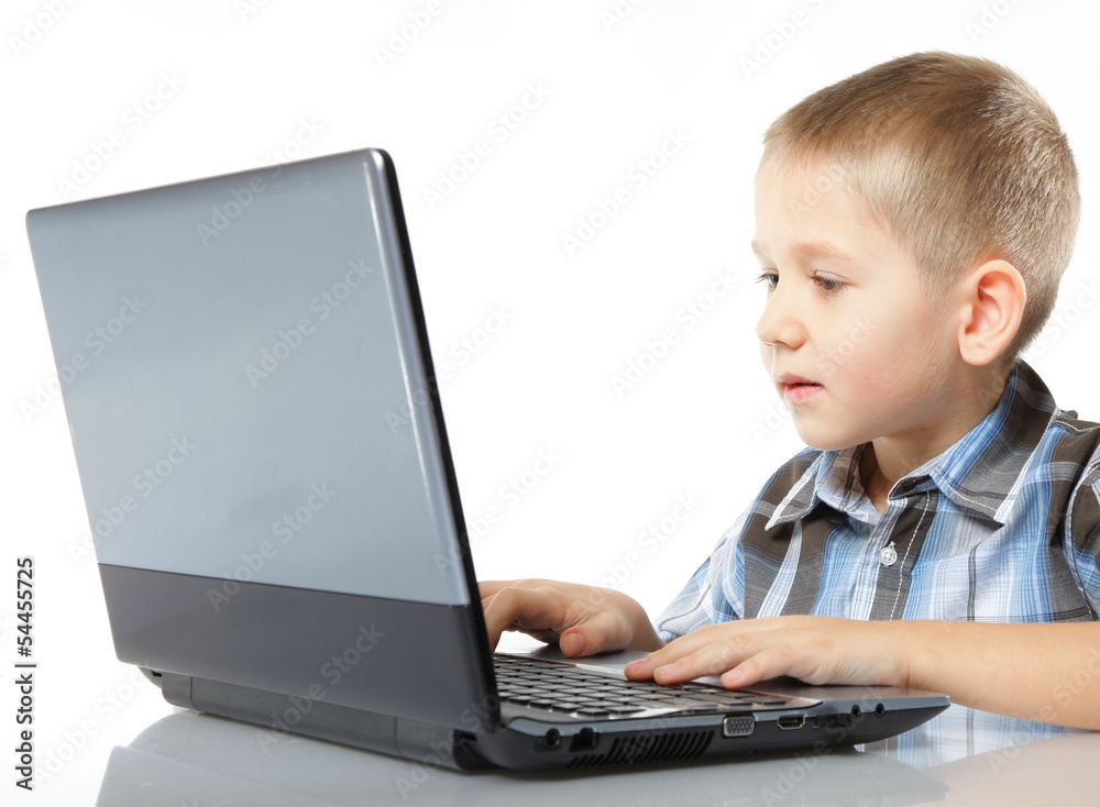 Computer addiction child with laptop notebook Computer addiction child with laptop notebook