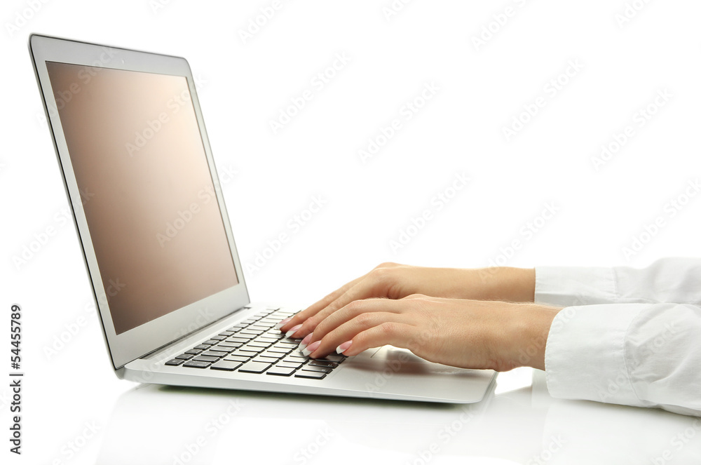female hands writing on laptot, isolated on white female hands writing on laptot, isolated on white